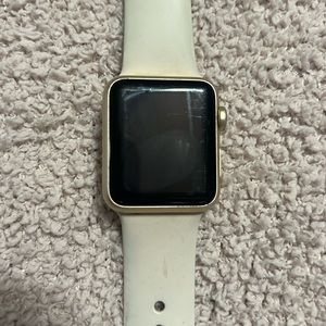 COPY - 1st generation gold Apple Watch with cream silicon band.